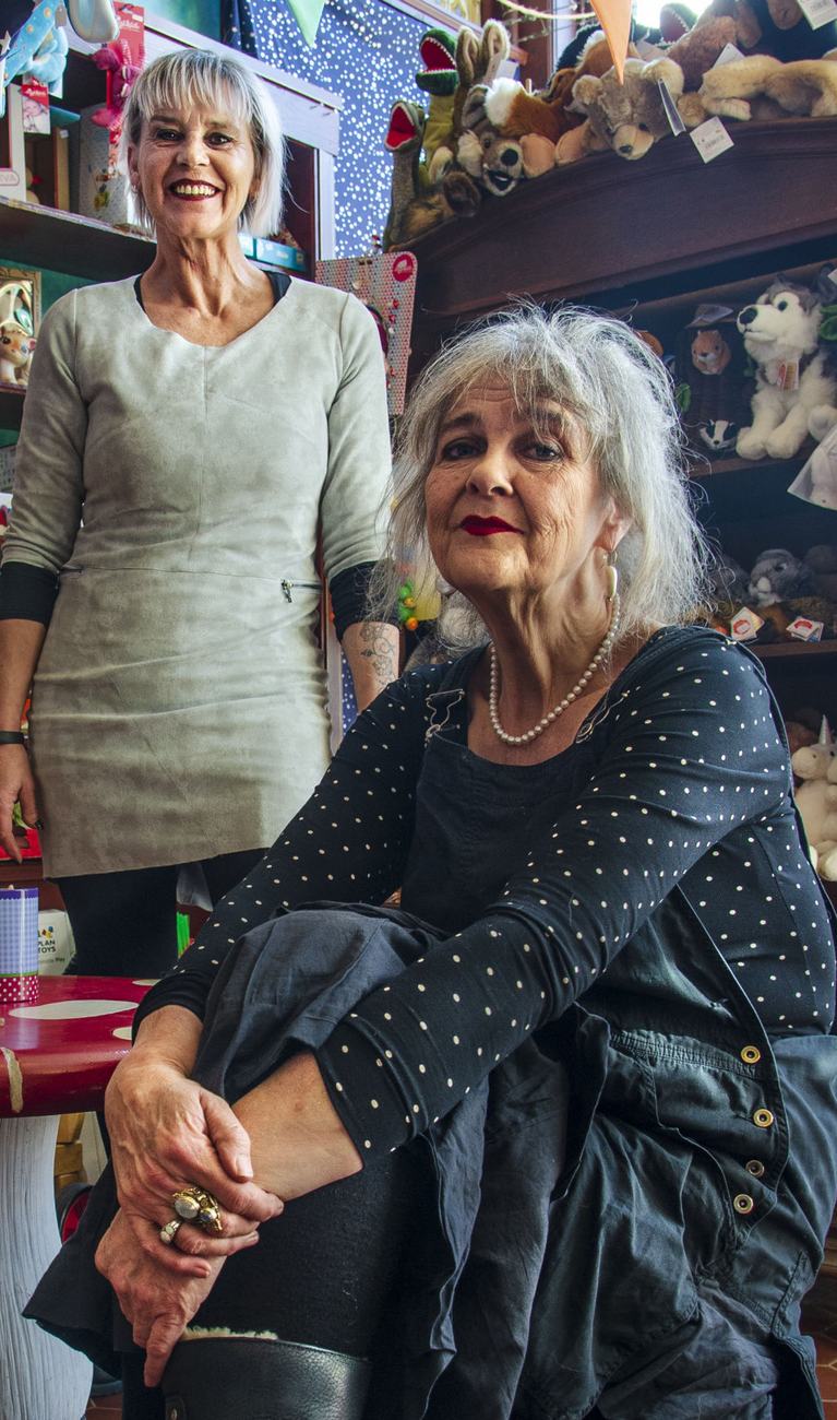 Two shopkeepers in a toy store